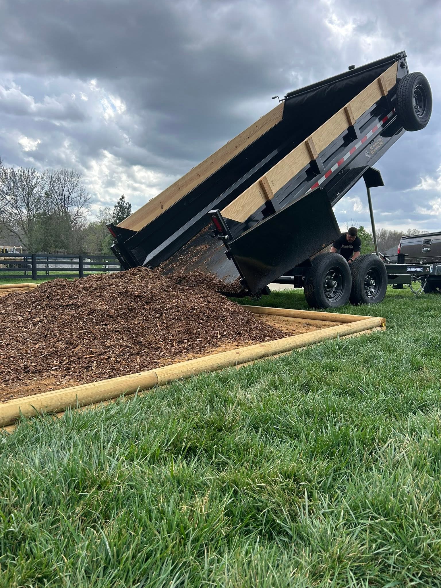 Loading wood and debris onto trailer for hauling in Louisville KY